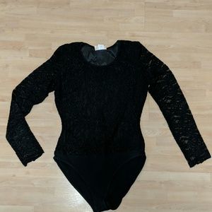 Body suit, fitted stretchy black lace.